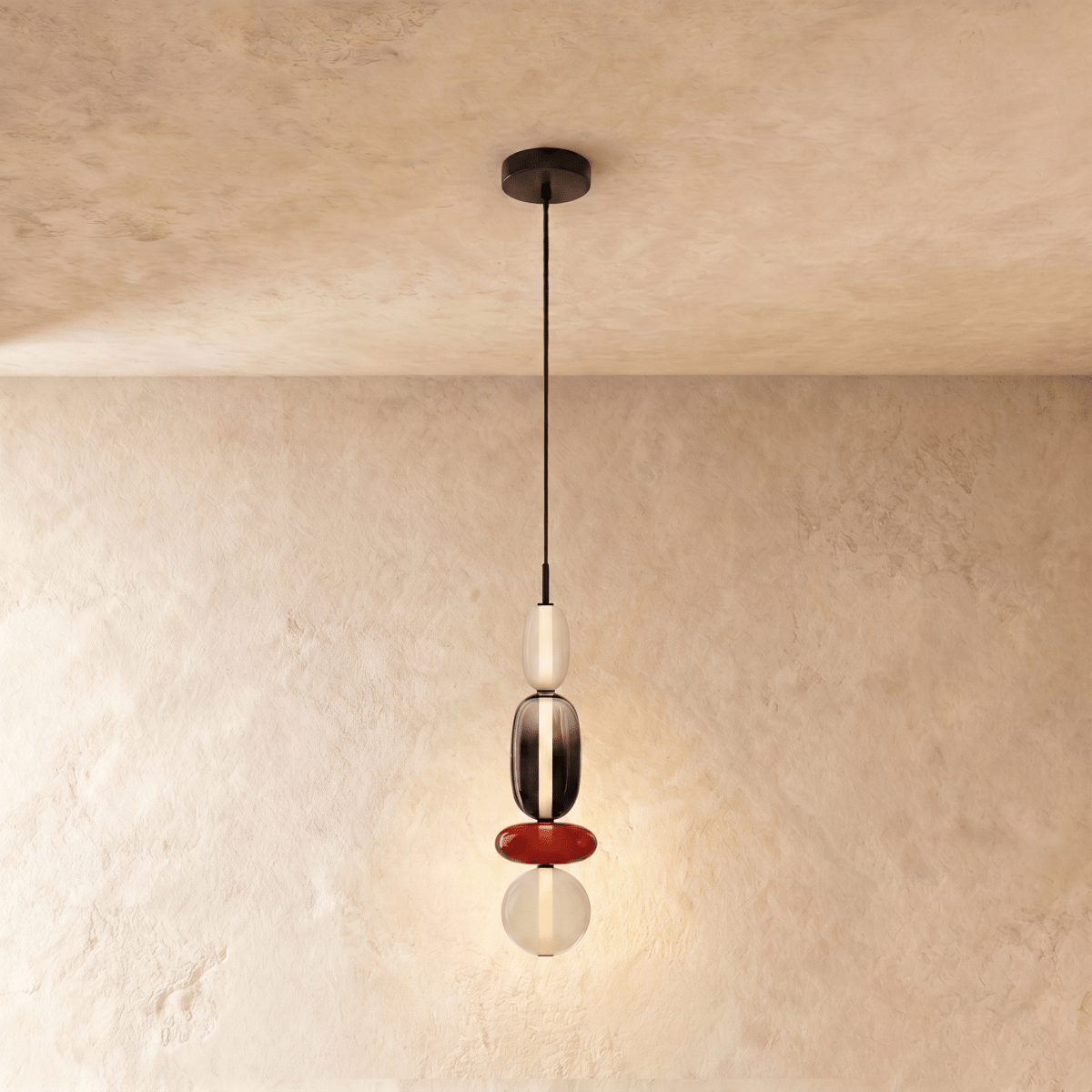 Clérachic four-tier pendant: frosted capsule, smoked capsule, red disc and opal globe, hanging from a slim black cord.