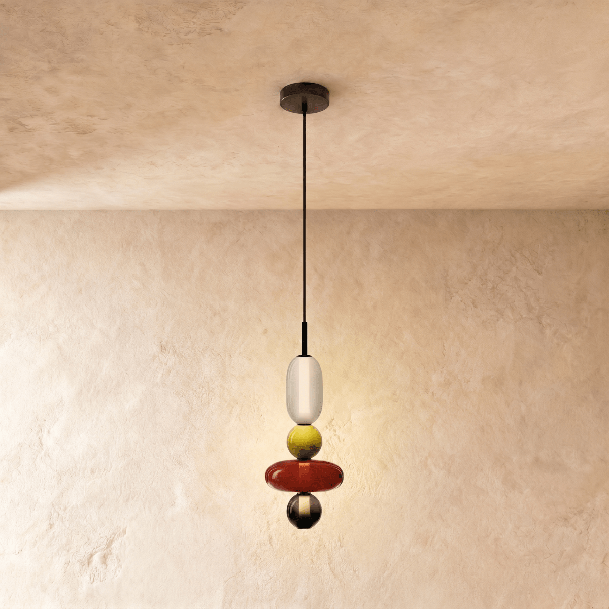 Clérachic pendant with a white capsule, chartreuse bead, broad red disc and small smoked bead on a limewash backdrop.