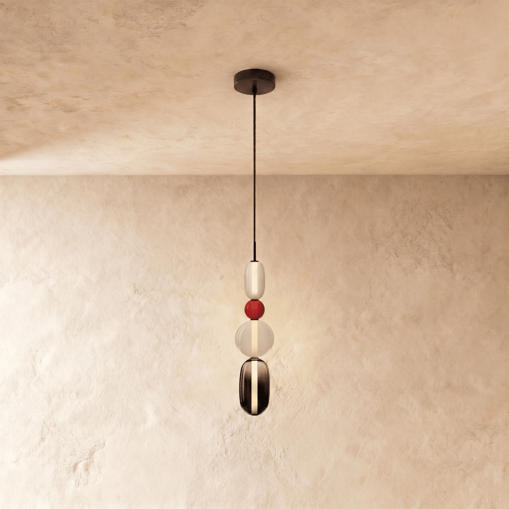 Clérachic tall pendant with a white capsule, red bead, opal globe and a smoked glass capsule with a glowing light strip.