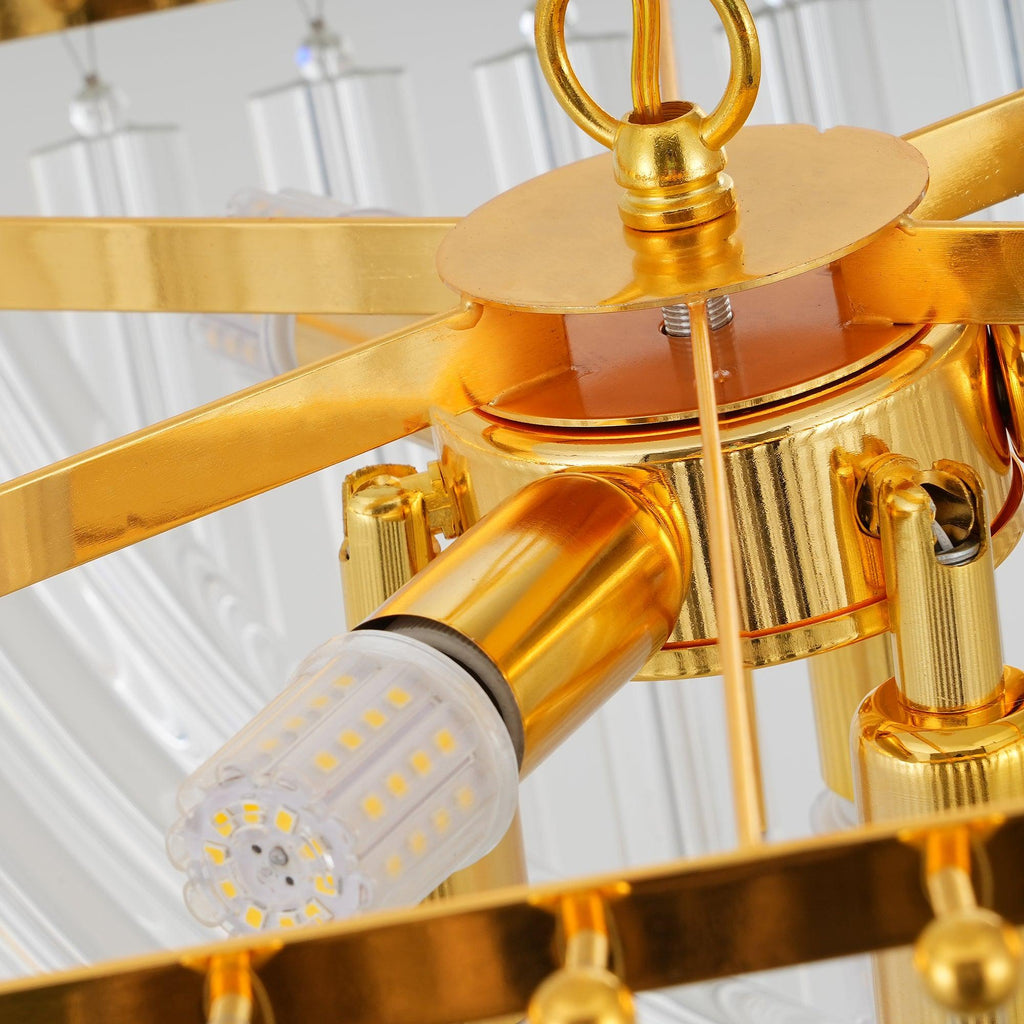 Close view of the central gold hub, a lamp holder with an LED corn bulb and the chain loop on this Clérachic chandelier.