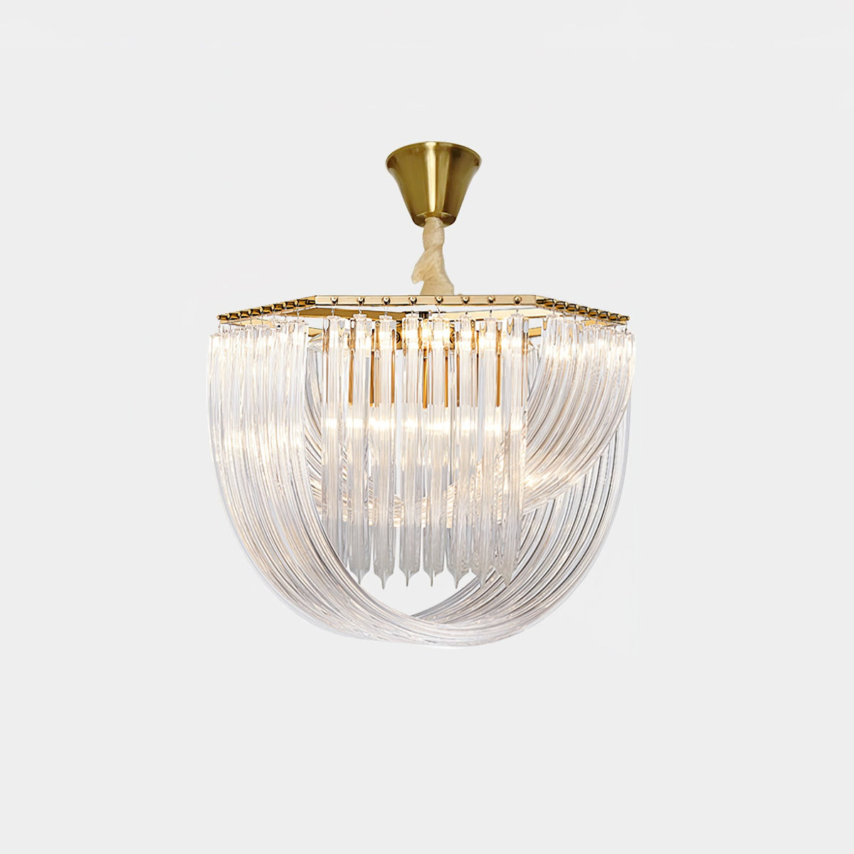 Unlit Clérachic chandelier with a brushed brass canopy and cord and a looped clear glass rod frame, on a pale grey backdrop.