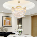 Clérachic glass chandelier under a round ceiling recess above a white marble table, with a colourful horse painting on the wall.