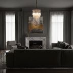 Slim looped-glass Clérachic chandelier lit in a dark grey living room with a marble fireplace and a gold-and-grey painting.