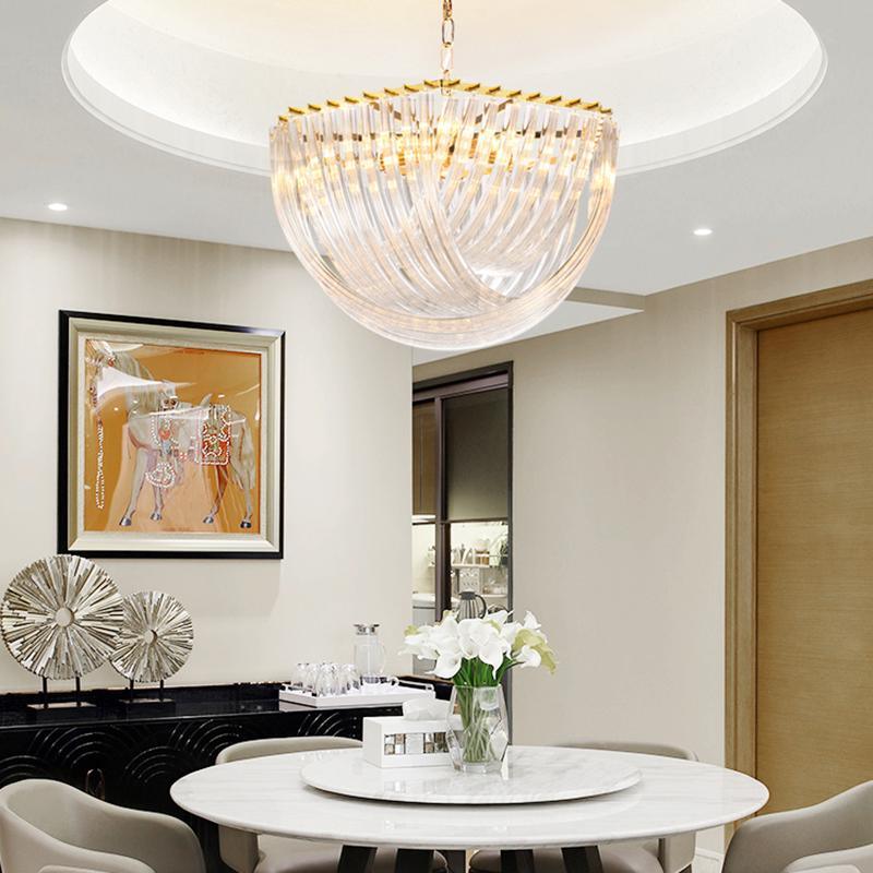 Clérachic glass chandelier under a round ceiling recess above a white round table with white tulips and a horse painting.