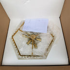 Clérachic chandelier frame packed in a cardboard box with white foam and a printed instruction sheet on top.