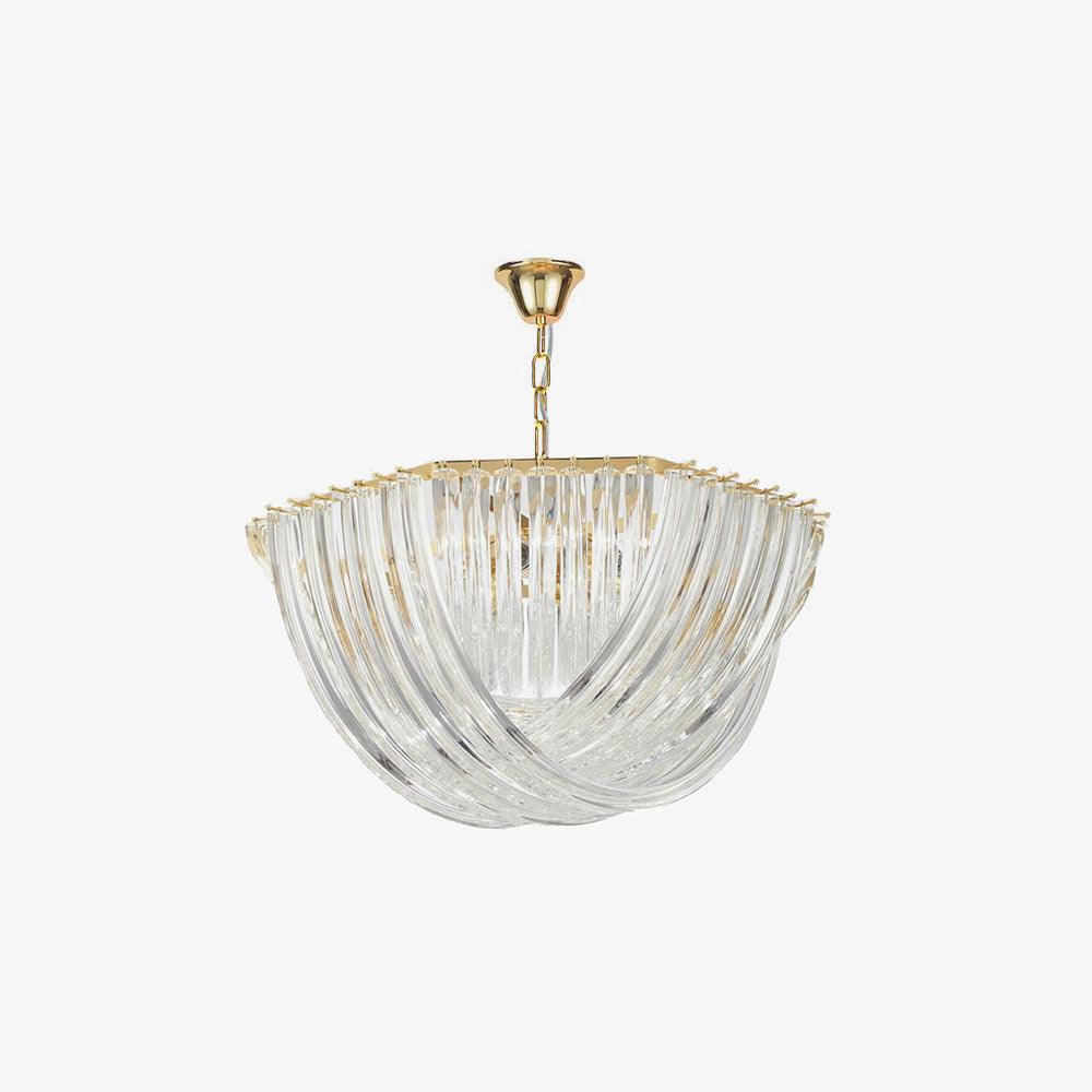 Slightly angled view of a Clérachic chandelier, with its curved clear glass rods and gold chain on a plain light backdrop.