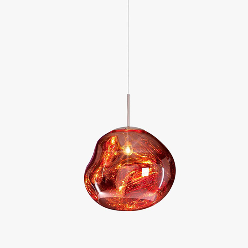 A Clérachic copper-red glass pendant on a light backdrop, with a silver rod and a glossy, rounded irregular shade.