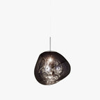 Clérachic smoke-grey glass pendant seen from the front on a light backdrop, with a dark shade and a silvery lit centre.