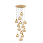 A tall Clérachic cluster of cognac glass shell pendants hangs from a round brass ceiling plate, on a white background.