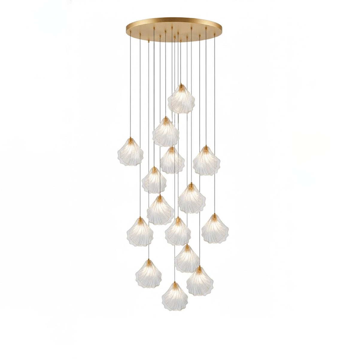 A tall Clérachic cluster of clear glass shell pendants on thin cords, hung at staggered heights from a round brass plate.