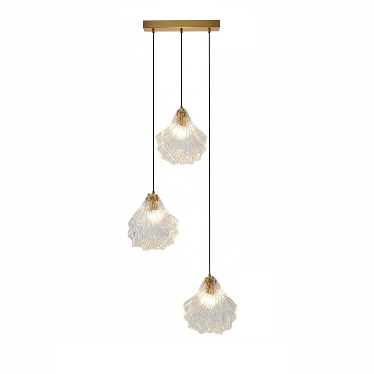 A Clérachic three-light pendant with clear glass shells hangs at three lengths from a straight brass bar, on white.