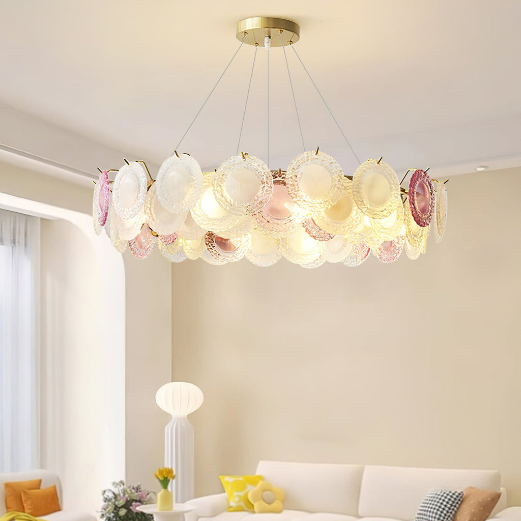 Clérachic ring pendant lit above a living room with a cream sofa and a white floor lamp, with an arched opening behind.