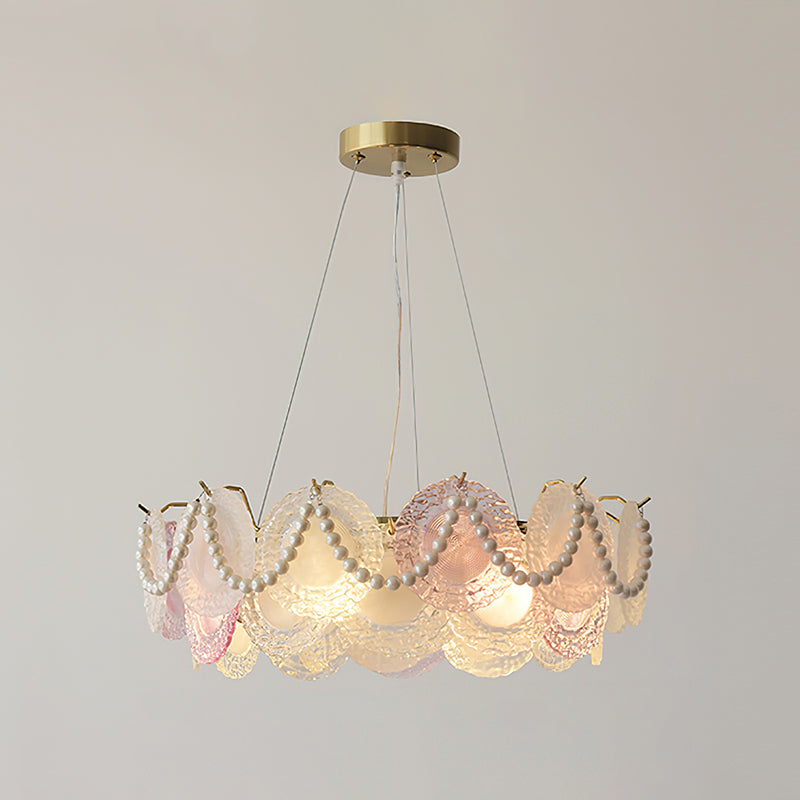 This Clérachic pendant with pearl swags, lit, with a pink disc at the front and frosted ones round the ring.