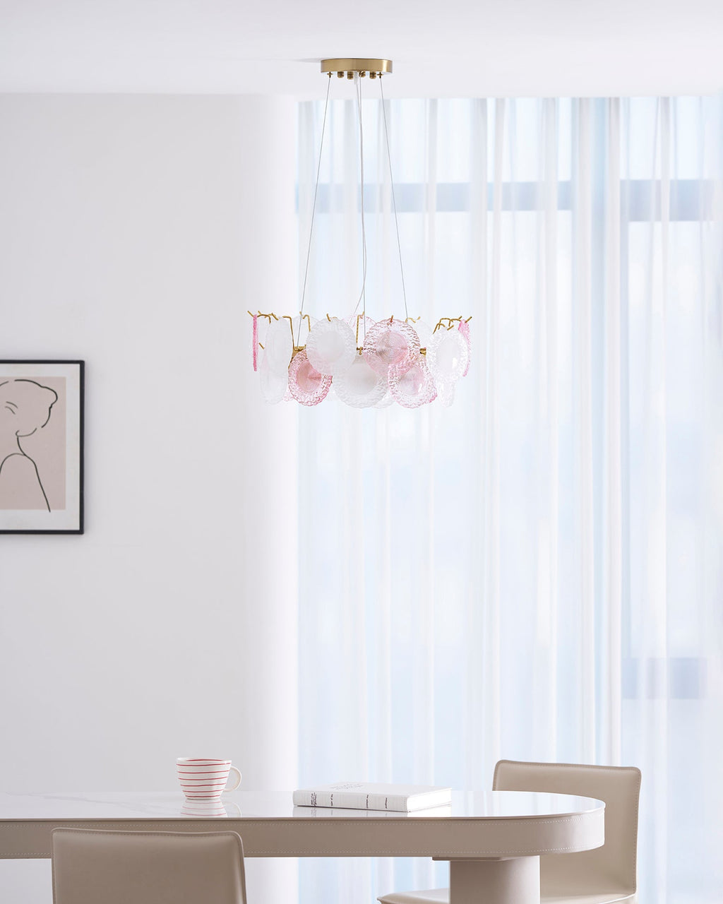 A distant view of the Clérachic pendant in a bright dining area, with sheer curtains and a table with chairs below.