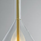 Close view of the brass stem passing through the glass neck of this Clérachic pendant, with the frosted shade just below.