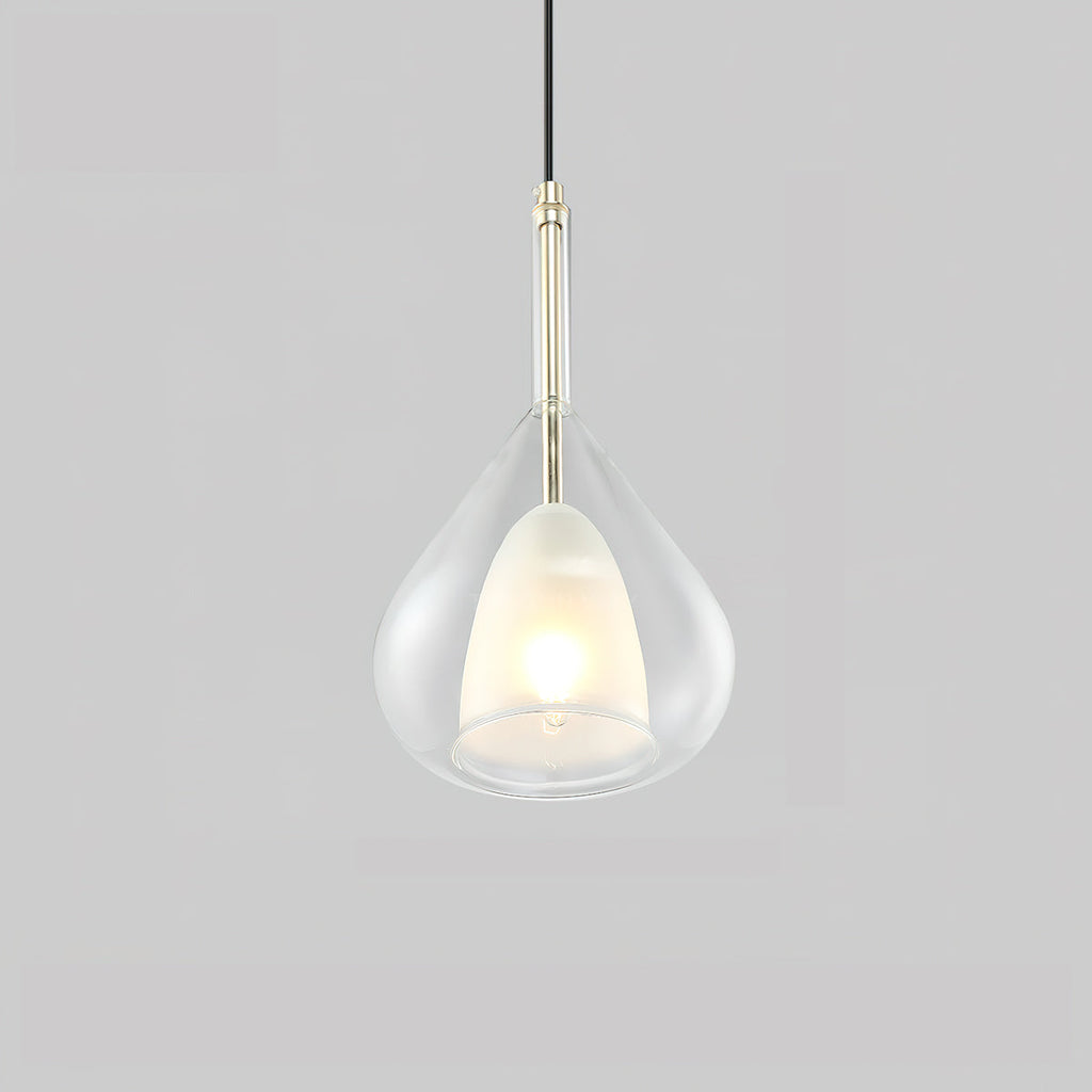 Transparent glass teardrop pendant from Clérachic on a pale grey backdrop, with a lit frosted inner shade and a slim light-coloured stem.