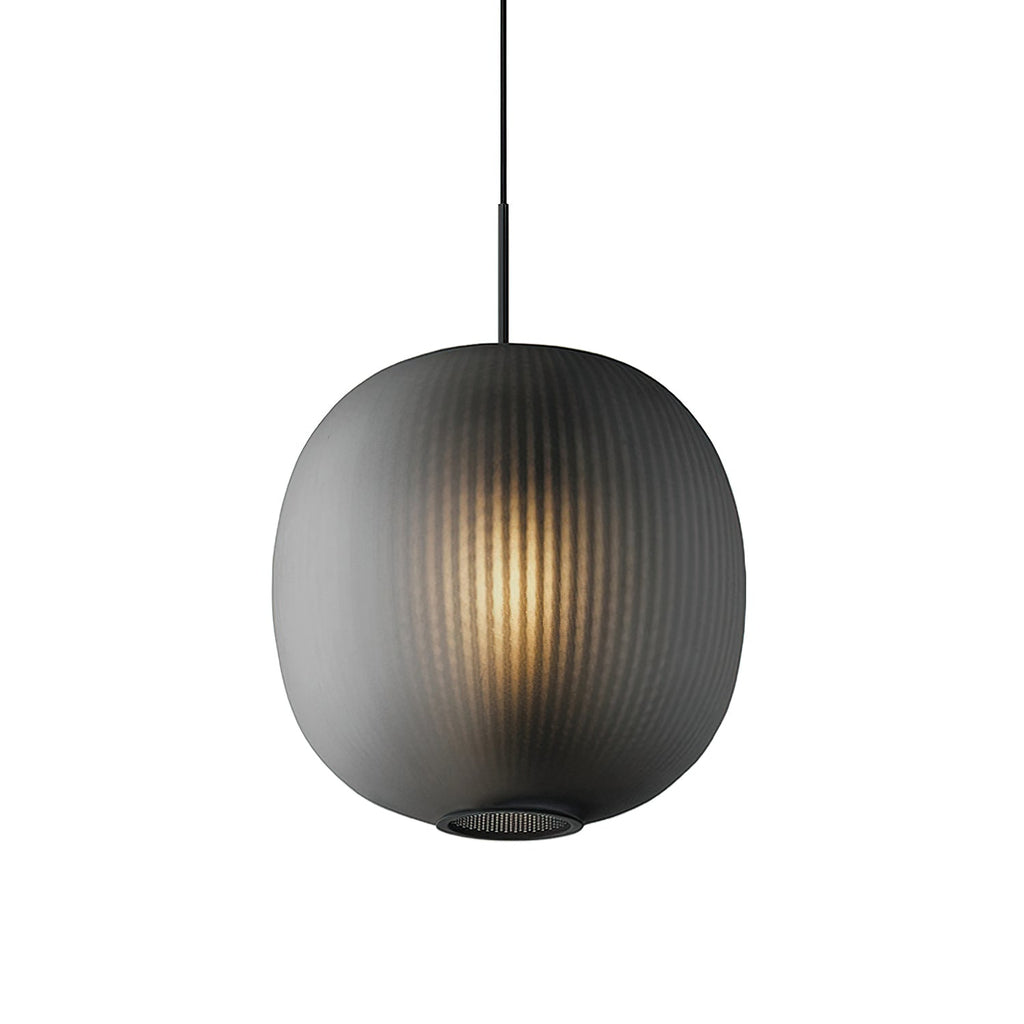 Front view of a smoke-grey Clérachic ribbed glass pendant, lit warmly, with fine vertical ribbing and a mesh ring at the base.