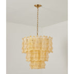 Switched-off yellow Clérachic pendant, showing the clear ribbed glass panels in three tiers under a brass ceiling plate.