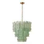 Green Clérachic pendant on a white backdrop, three tiers of green-speckled wavy glass under a brass canopy.