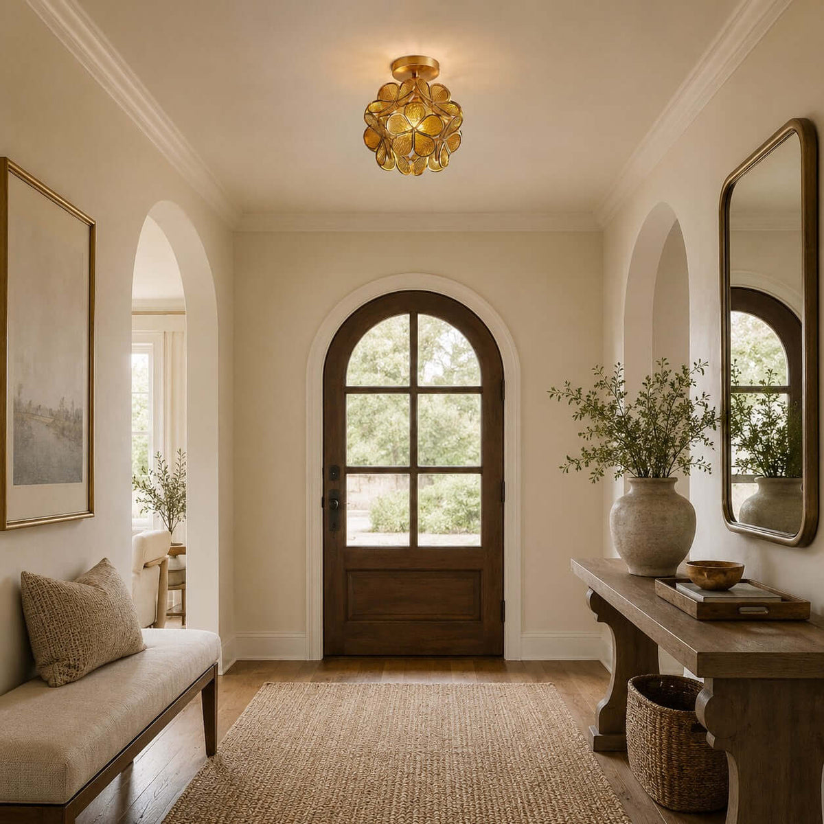 Clérachic ceiling light of clear glass petals in an entrance with an arched wooden door, a bench and a woven basket.