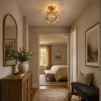 Clear glass-petal Clérachic ceiling light casting dappled light on a hall ceiling, with a carved sideboard and a bedroom beyond.
