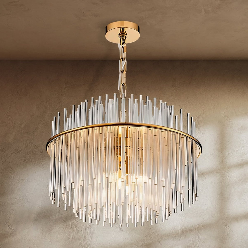 Clérachic round gold chandelier with a ring of clear glass rods rising above and falling below, hung from a chain and ceiling plate.