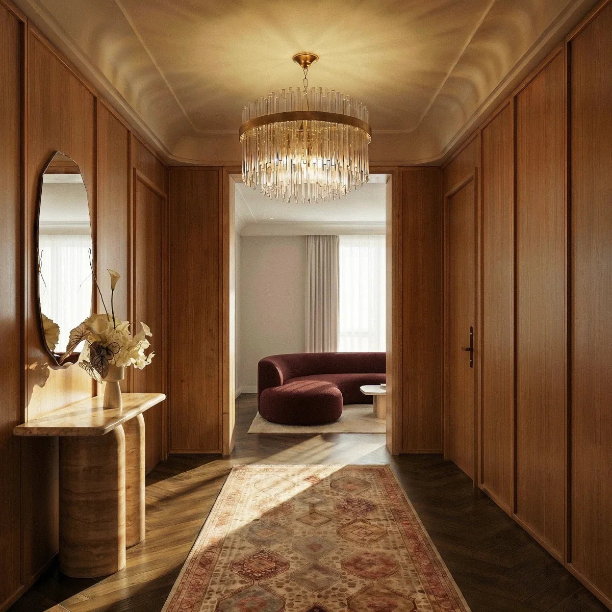Clérachic round glass-rod chandelier with a gold band, lit in a panelled hallway with a console table and a runner.