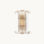Front view of this Clérachic wall light on a plain white backdrop, with ribbed glass rods between two curled arms and a warm glow inside.