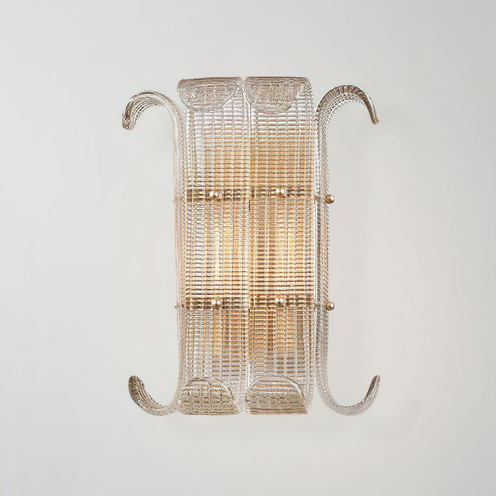 The wider version of this Clérachic wall light, with two glass panels side by side and curled arms, glowing warm on a light grey wall.