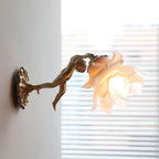 Side profile of the Clérachic glass rose wall sconce against a shuttered window, daylight passing through the frosted glass petals.