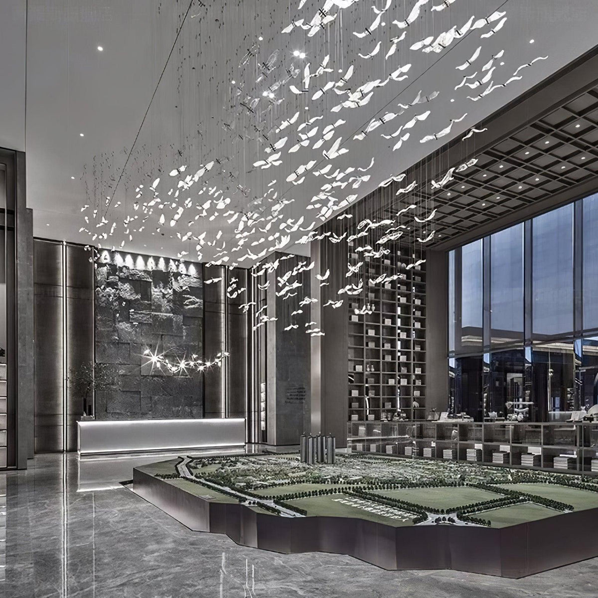 This Clérachic seagull chandelier fills a double-height lobby with hundreds of glass birds above a polished stone floor.