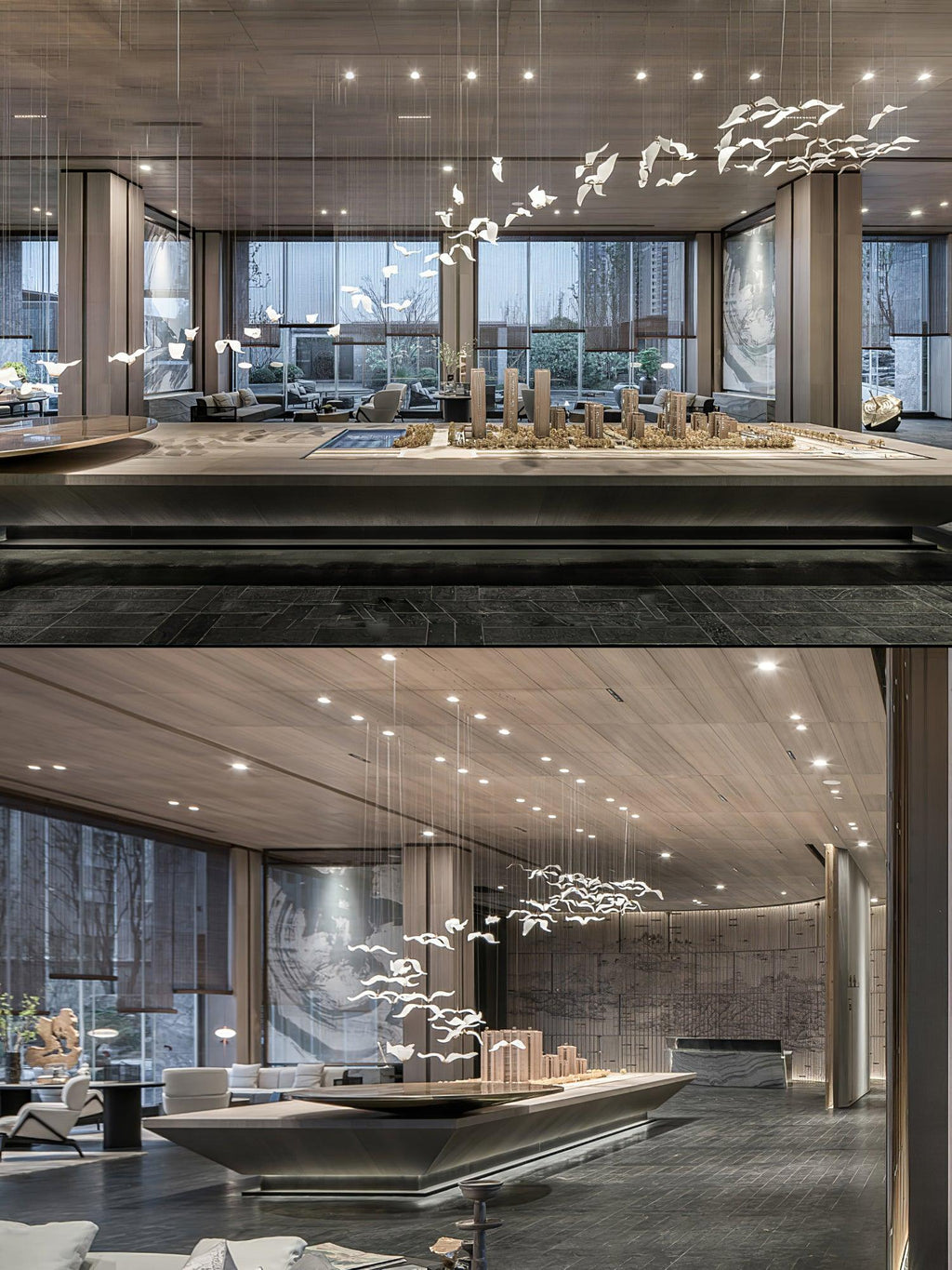 Two views of this Clérachic seagull chandelier hanging high above scale models in a large showroom with a timber ceiling.