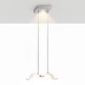 A single lit Clérachic seagull pendant hangs on two cables from a square chrome canopy with a warm downlight.