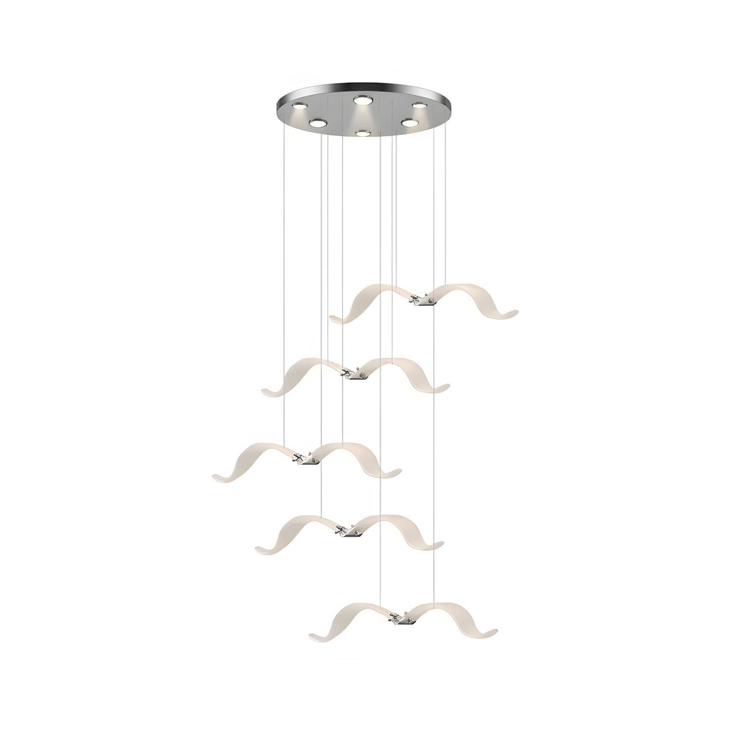 This Clérachic seagull chandelier has a small chrome canopy and five lit gulls stepping down on fine cables.