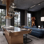 Smoke grey Clérachic pendants hang above a marble-topped wooden kitchen island, with a blue sofa in the room behind.