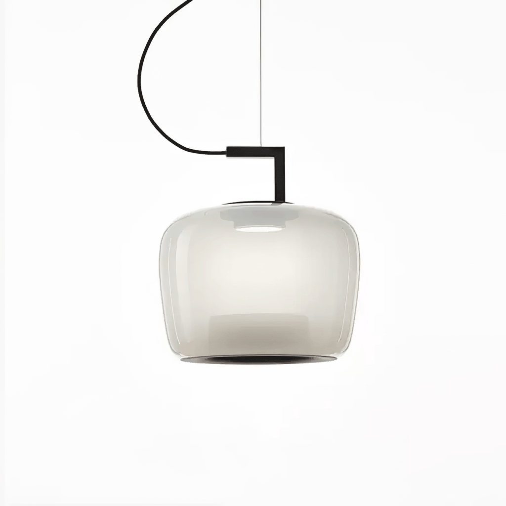 Squat foggy white glass Clérachic pendant on a curved cord, glowing evenly with a black bracket, on white.
