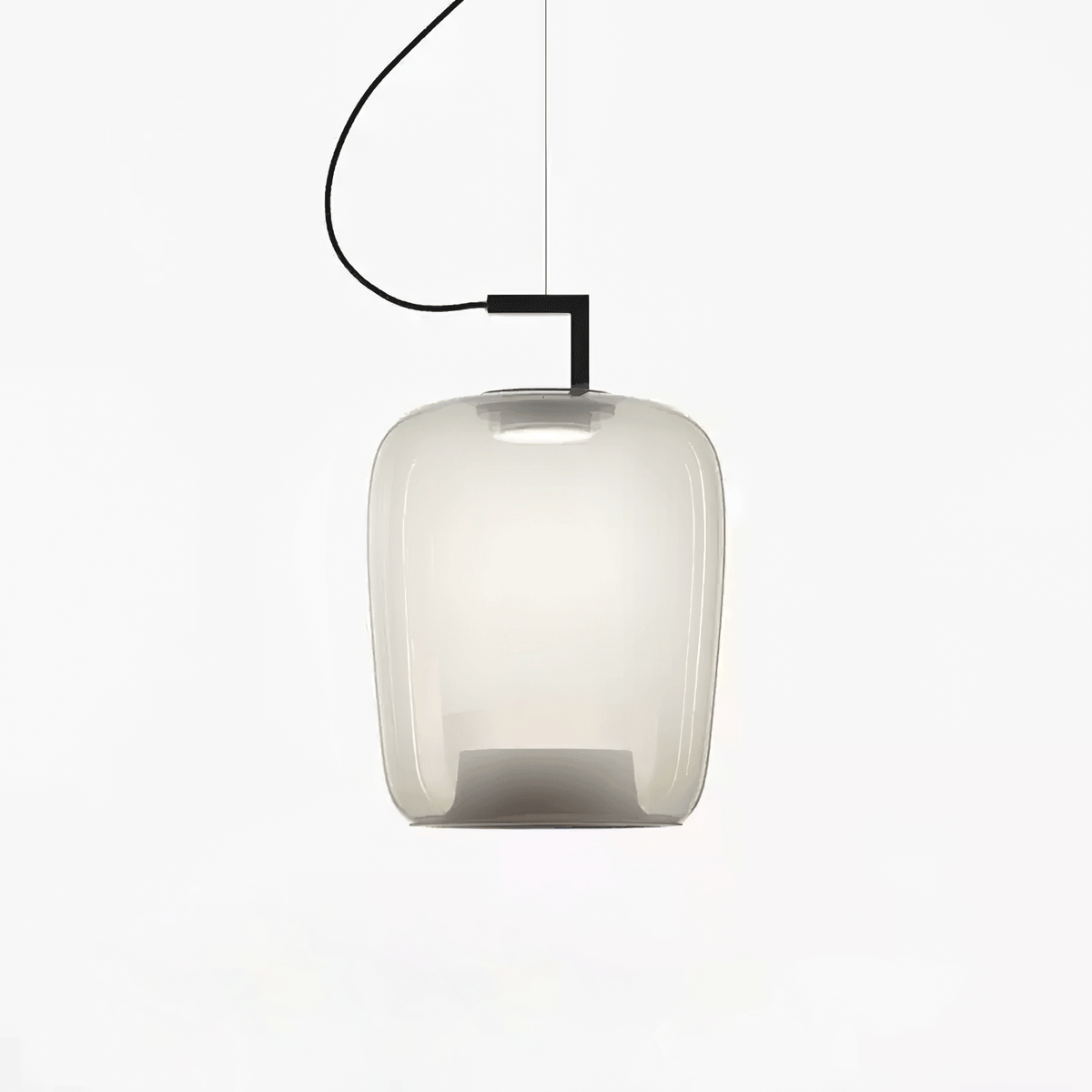 Tall foggy white glass Clérachic pendant with a black bracket and a soft glow, on a plain white backdrop.