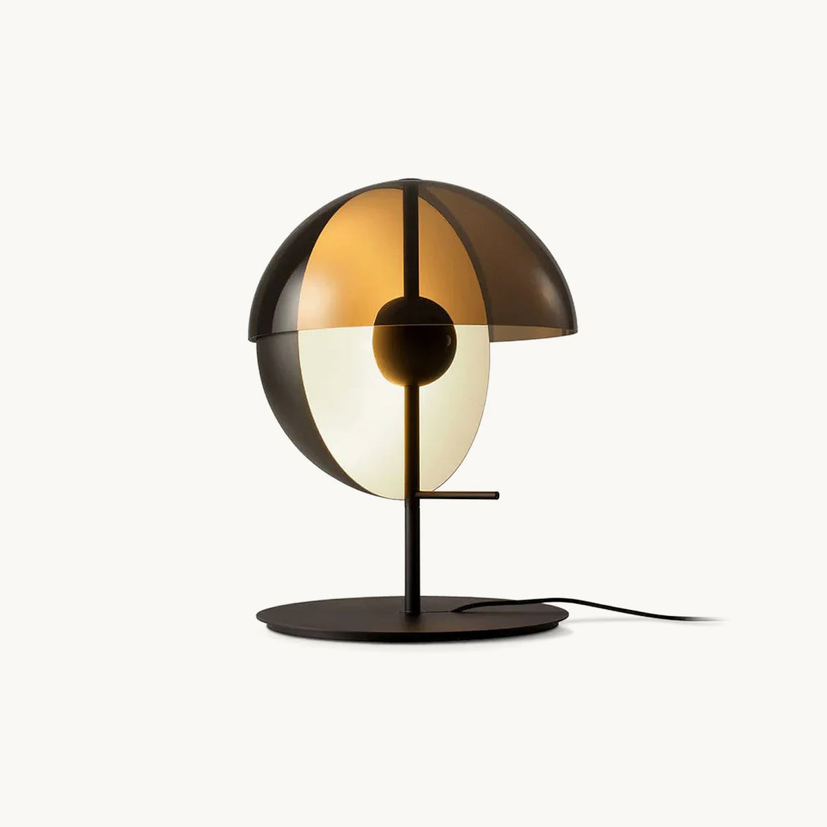 Black Clérachic table lamp with a smoked-amber half-dome shade over a white glass half-sphere, on a round base against white.