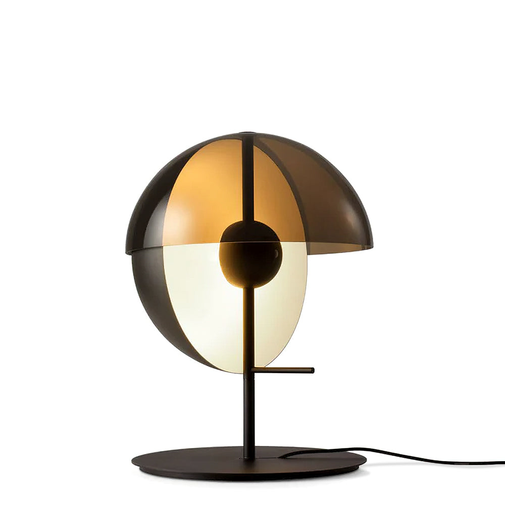 Black-based Clérachic table lamp shown straight on against white, its amber dome above a white half-sphere on a black stem.