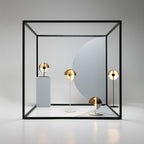 Four lamps from Clérachic in this range stand inside a black cube frame in a pale studio, two table lamps and two floor lamps.
