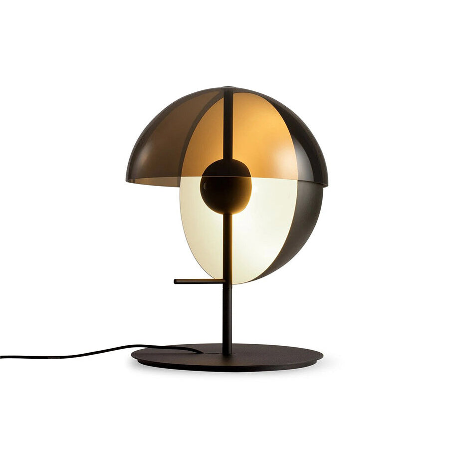 Black Clérachic table lamp with a smoked half-dome shade and a pale half-sphere, seen at a slight angle on white.