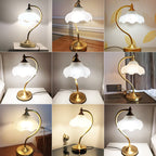 A collage of nine home photos of this Clérachic lamp, lit and unlit, on shelves, tables and cabinets in different rooms.