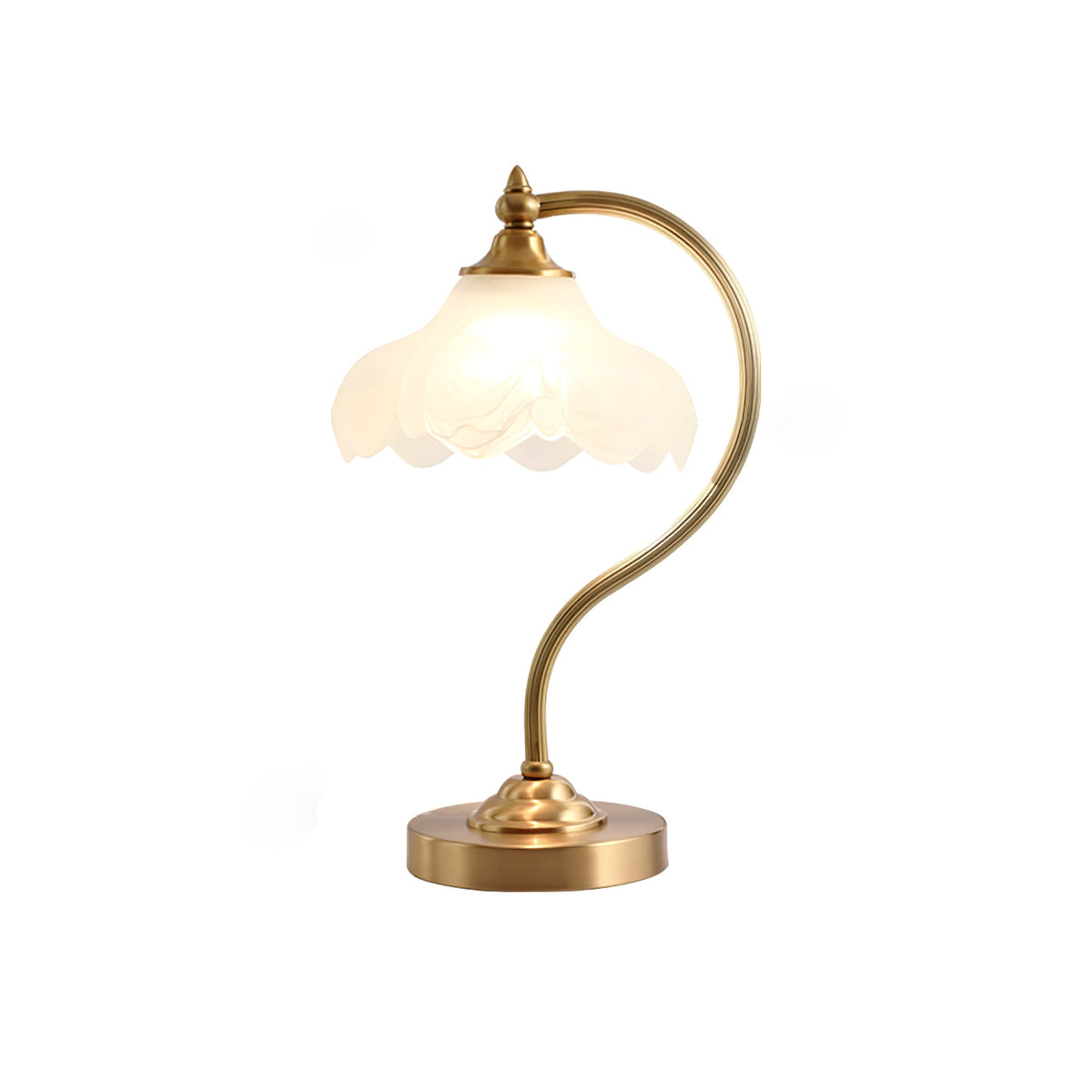 This Clérachic lamp softly lit on white, with its frosted shade glowing and a wide round brass base below.