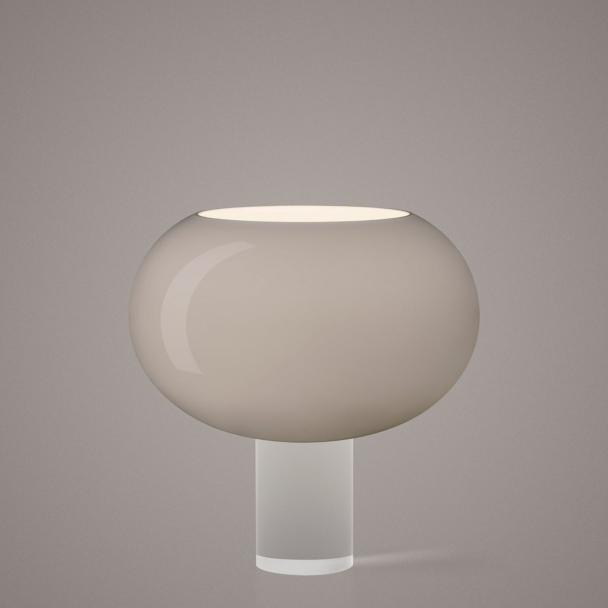 The grey-toned version of this Clérachic table lamp, its wide frosted glass shade on a clear cylindrical base, on a soft grey backdrop.