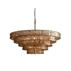 Smoky bronze-brown glass tiers on this Clérachic chandelier, with a brass stem and chain, on a white background.