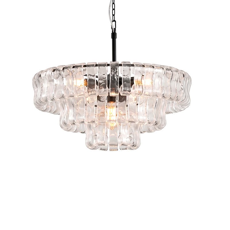 Three clear glass tiers and a black stem on this Clérachic chandelier, with warm bulbs glowing inside, on white.