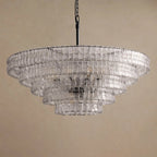 Wide clear-glass chandelier from Clérachic on a black chain, with a dark centre showing through the tiers, on tan.