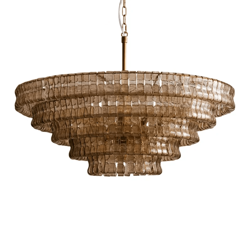 Honey-brown glass Clérachic chandelier on a brass stem, five tiers seen at a slight angle, on a white background.
