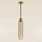 The clear pendant unlit in daylight, its thick cut glass and vertical facets reading as solid crystal rather than a glow