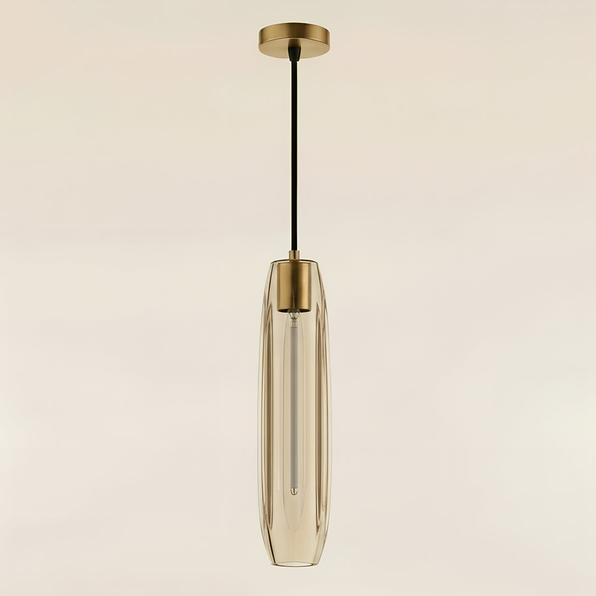 The clear pendant unlit in daylight, its thick cut glass and vertical facets reading as solid crystal rather than a glow
